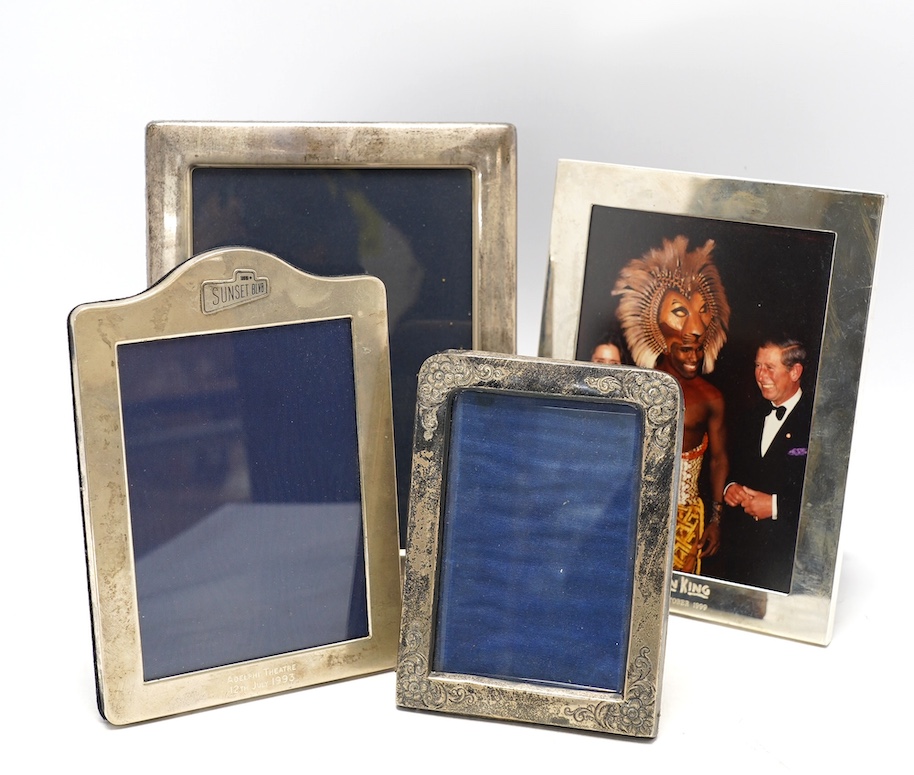 A late Victorian silver mounted photograph frame, with engraved floral decoration, Birmingham, 1898, 14.9cm and three modern silver mounted photograph frames. Condition - fair